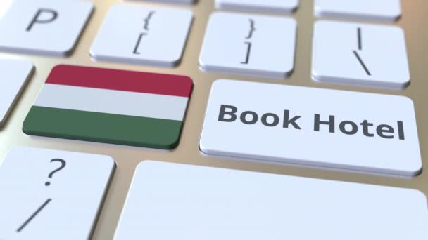 Bilgisayar klavyesindeki düğmelerde Kitap Otel metin ve Macaristan bayrağı. Seyahat ile ilgili kavramsal 3d animasyon — Stok video