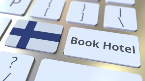 BOOK HOTEL text and flag of Finland on the buttons on the computer keyboard. Travel related conceptual 3D animation — Stock Video