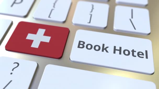 BOOK HOTEL text and flag of Switzerland on the buttons on the computer keyboard. Travel related conceptual 3D animation — Stock Video