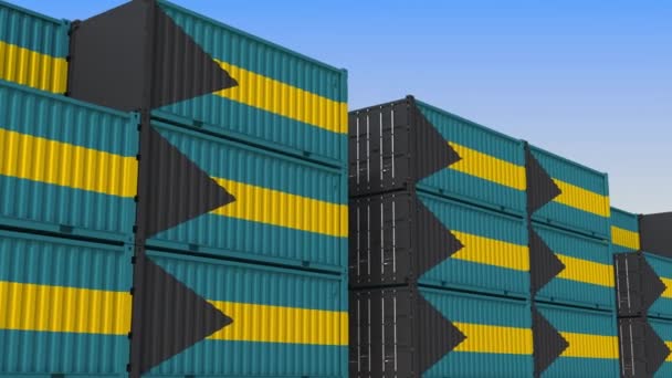 Kontejnerový dvůr plný nádob s vlajkou Baham. Bahamské exporty nebo importy související smykliatelná 3D animace — Stock video