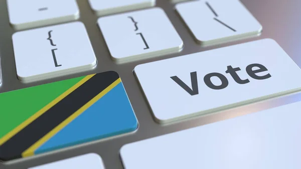 VOTER le texte et le drapeau de Tanzanie sur les boutons du clavier de l'ordinateur. Rendu 3D conceptuel lié à l'élection — Photo