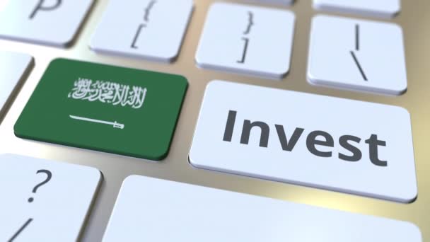 INVEST text and flag of Saudi Arabia on the buttons on the computer keyboard. Business related conceptual 3D animation — Stock Video