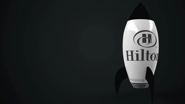 Logo de HILTON em um foguete de brinquedo. Renderização 3D relacionada ao sucesso conceitual editorial — Fotografia de Stock