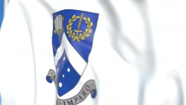 Hullámzó zászló Monash Egyetem emblémával, közeli. Szerkesztőségi loopable 3D animáció — Stock videók