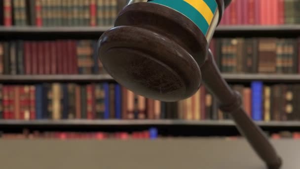 Flag of Bahamas on falling judges gavel in court. National justice or jurisdiction related conceptual 3D animation — Stock Video