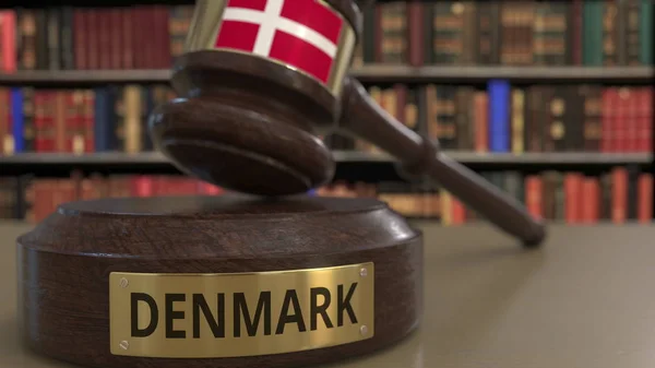 Flag of Denmark on judges gavel in court. National justice or jurisdiction related conceptual 3D rendering — Stock Photo, Image