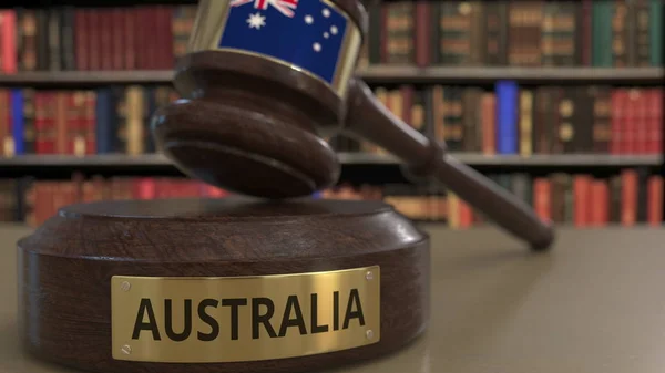 Flag of Australia on falling judges gavel in court. National justice or jurisdiction related conceptual 3D rendering — Stock Photo, Image