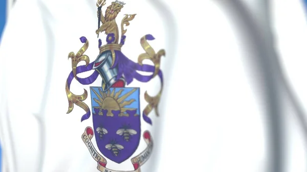 Bandeira acenando com emblema da Universidade de Manchester, close-up. Renderização 3D editorial — Fotografia de Stock
