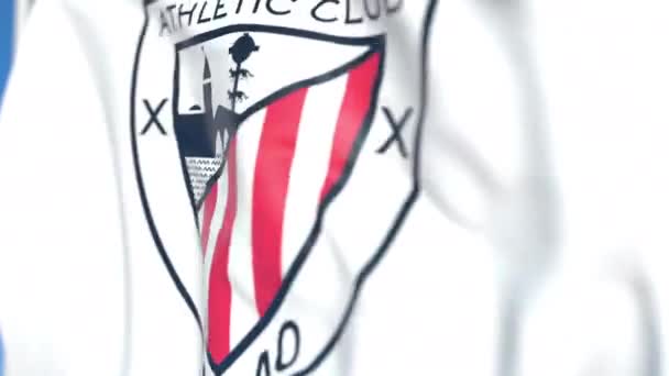 Falowanie flaga z Athletic Bilbao klubu piłkarskiego logo, zbliżenie. Redakcyjnej pętli animacji 3D — Wideo stockowe