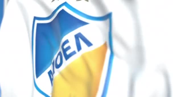 Acenando bandeira com o logotipo do clube de futebol Apoel FC, close-up. Editorial loopable animação 3D — Vídeo de Stock