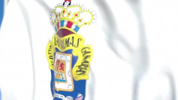 Bandera ondeando con el logo del club de fútbol UD Las Palmas, de cerca. Animación en 3D loopable editorial — Vídeo de stock