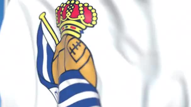 Bandera ondeando con el logotipo del club de fútbol Real Sociedad, primer plano. Animación en 3D loopable editorial — Vídeo de stock