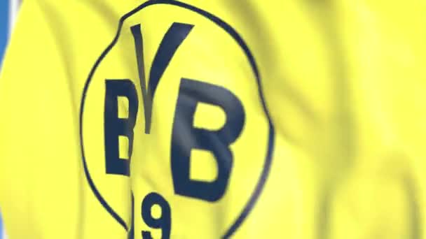 Borussia Dortmund futbol takımı logosu ile bayrak sallayarak, yakın çekim. Editoryal döngülü 3d animasyon — Stok video