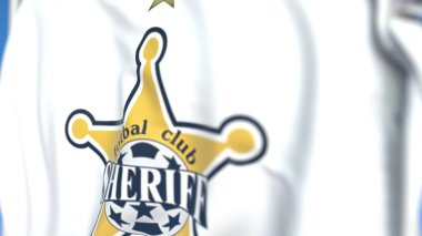 Waving flag with FC Sheriff Tiraspol football club logo, close-up. Editorial 3D rendering clipart
