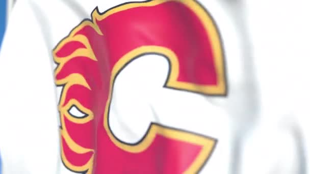 Waving flag with Calgary Flames NHL hockey team logo, close-up. Editorial loopable 3D animation — Stock Video