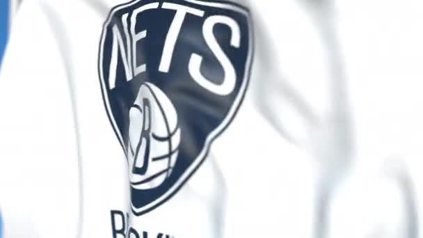 Размахиваю флагом с логотипом команды Бруклин Нетс, крупным планом. Передвижная 3D-анимация — стоковое видео