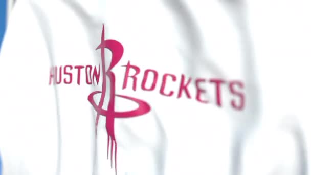 Waving flaga z Houston Rockets logo zespołu, zbliżenie. Redakcyjnej pętli animacji 3D — Wideo stockowe
