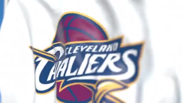 Acenando bandeira com o logotipo da equipe Cleveland Cavaliers, close-up. Editorial loopable animação 3D — Vídeo de Stock