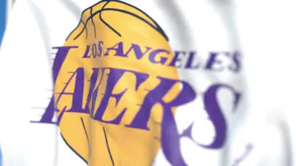 Zamával praporkem s logem Los Angeles Lakers, zblízka. Redakční smykliatelná 3D animace — Stock video