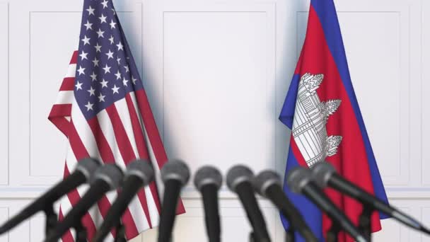 Banderas de los Estados Unidos y Camboya en la reunión o conferencia internacional. Animación 3D — Vídeo de stock