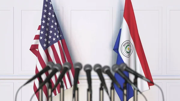Прапори США і Парагвай на міжнародній нараді або конференції. 3D-рендерінг — стокове фото