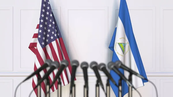 Flagi USA i Nikaragui na międzynarodowym spotkaniu lub konferencji. Renderowanie 3D — Zdjęcie stockowe