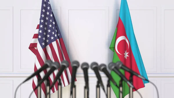 Vlaggen van de Verenigde Staten en Azerbeidzjan op internationale vergadering of conferentie. 3D-rendering — Stockfoto