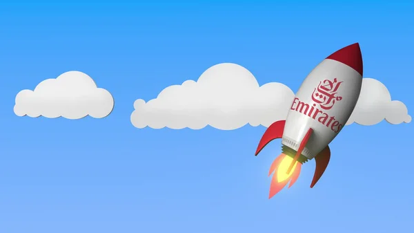 EMIRATES AIRLINES logo contra um foguete mockup. Renderização 3D relacionada ao sucesso editorial — Fotografia de Stock