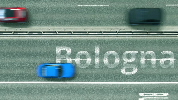 Letecký shora dolů pohled na silnici s auty odhalující titulek Boloňa. Cestování autem v Itálii 3D vykreslování — Stock fotografie