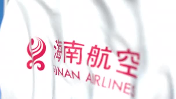 Bandera de vuelo con logo Hainan Airlines, primer plano. Animación en 3D loopable editorial — Vídeos de Stock