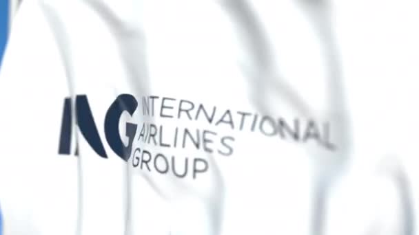 Flying flag with International Airlines Group logo, close-up. Editorial loopable 3D animation — Stock Video