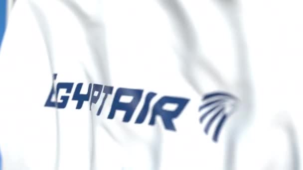 Розмахуючи прапор з логотипом Egyptair, Крупний план. Редакційна анімація 3D-анімації — стокове відео