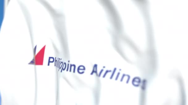 Vliegende vlag met Philippine Airlines logo, close-up. Redactionele loop bare 3D-animatie — Stockvideo