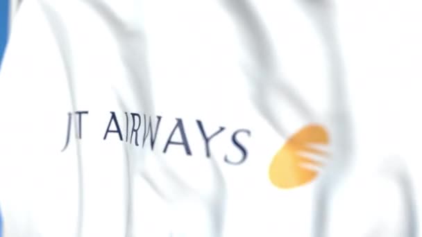 Flygande flagga med Jet Airways logotyp, närbild. Redaktionell loopable 3D-animering — Stockvideo