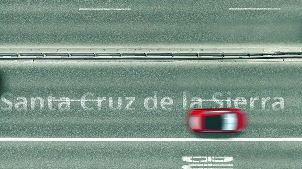Vista de arriba hacia abajo de la carretera con revelador texto de Santa Cruz de la sierra. Conducción en Bolivia 3D rendering — Foto de Stock