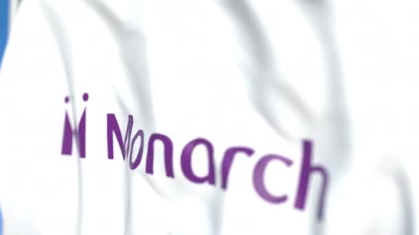 Флаг с логотипом Monarch Airlines, крупным планом. Передвижная 3D-анимация — стоковое видео