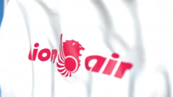 Latająca flaga z logo Lion Air, zbliżenie. Redakcyjnej pętli animacji 3D — Wideo stockowe