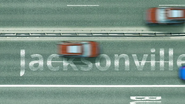 Vista aérea hacia abajo de la autopista con coches revelando Jacksonville título. Viaje en coche a los Estados Unidos 3D rendering —  Fotos de Stock
