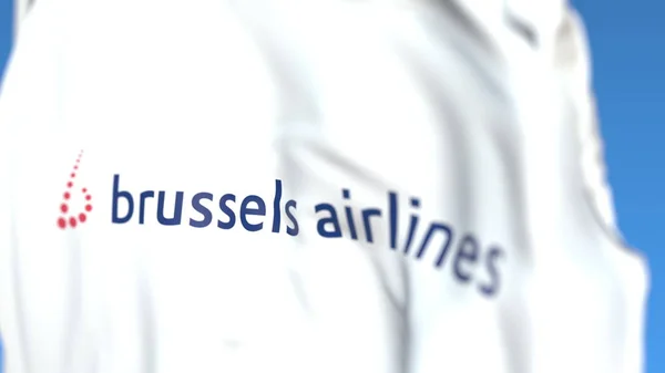 Flagge schwenkend mit dem Logo der Brüsseler Fluggesellschaft, Großaufnahme. redaktionelles 3D-Rendering — Stockfoto