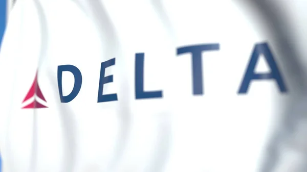 Delta Air Lines logosuyla bayrak sallamak, yakın çekim. Editoryal 3d render — Stok fotoğraf