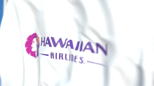 Vliegende vlag met Hawaiian Airlines logo, close-up. Redactionele 3D-rendering — Stockfoto
