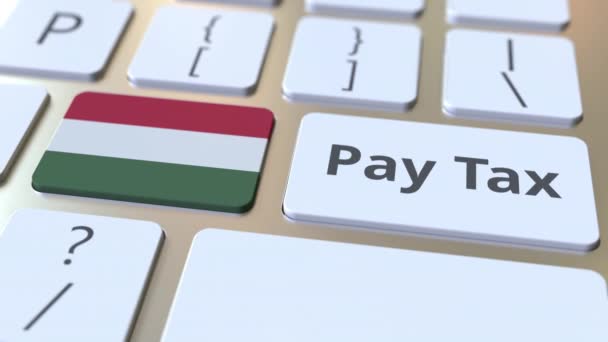 Bilgisayar klavyesindeki düğmelerde Vergi metni ve Macaristan bayrağını ödeyin. Vergilendirme ile ilgili kavramsal 3d animasyon — Stok video