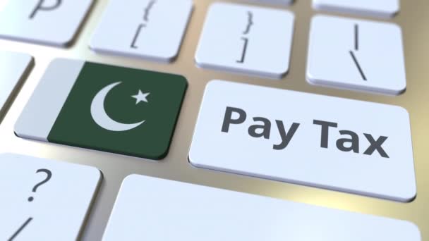 PAY TAX текст и флаг Пакистана на клавиатуре компьютера. Концептуальная 3D анимация — стоковое видео