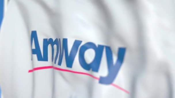 Drapeau volant avec logo Amway, gros plan. Animation 3D en boucle éditoriale — Video