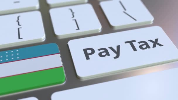 Оплатити податковий текст і прапор Узбекистану на кнопках на клавіатурі комп'ютера. Податкова концептуальна 3D анімація — стокове відео
