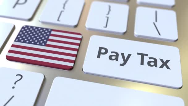 PAY TAX text and flag of the United States on the buttons on the computer keyboard. Taxation related conceptual 3D animation — Stock Video