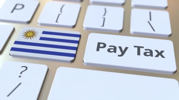 Pay adó szövegét és zászlaja Uruguay a gombokat a számítógép billentyűzetén. Adózással kapcsolatos fogalmi 3D animáció — Stock videók