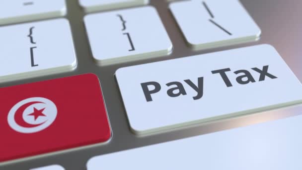支付税文本和突尼斯国旗在计算机键盘上。税务相关概念 3d 动画 — 图库视频影像