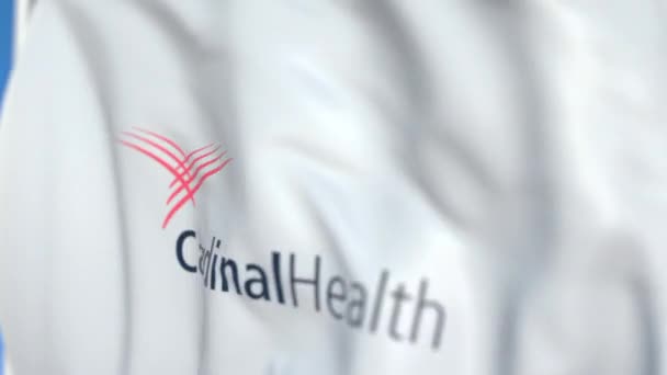 Bandeira voadora com logotipo da Cardeal Health, close-up. Editorial loopable animação 3D — Vídeo de Stock