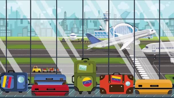 Suitcases with Venezuelan flag stickers on baggage carousel in airport. Tourism in Venezuela conceptual loopable cartoon animation — Stock Video